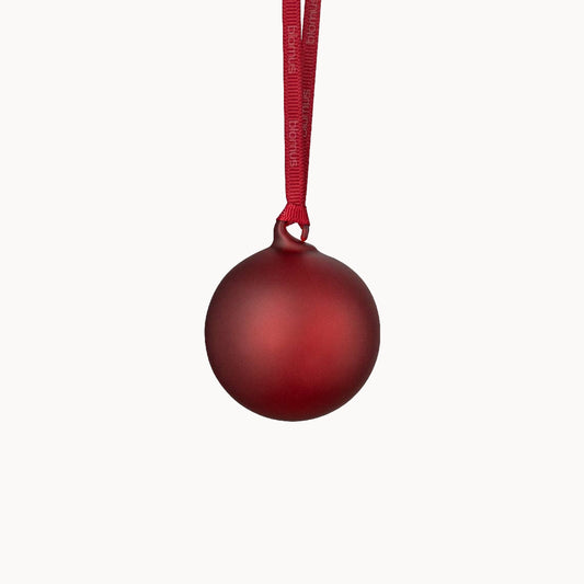 Burgundy Christmas ball ornament on a white background