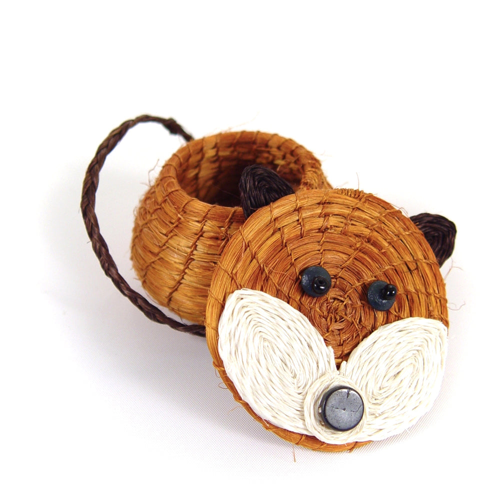 Woven fox-shaped toy on a white background