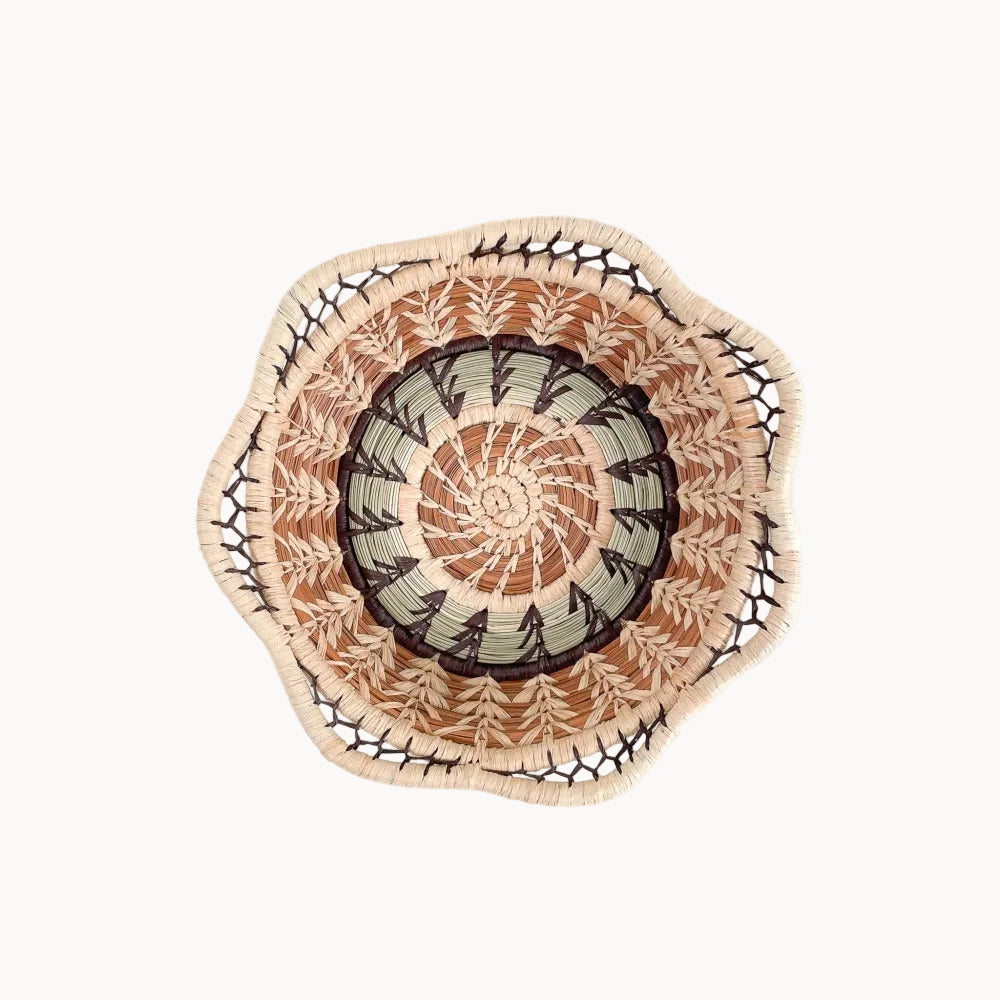 Decorative woven plate with a geometric pattern on a white background