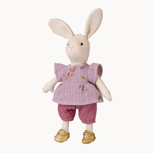 Stuffed rabbit toy wearing a pink dress with floral embroidery on a white background