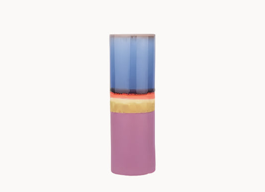 Colorful cylindrical vase with a gradient from blue to pink on a white background