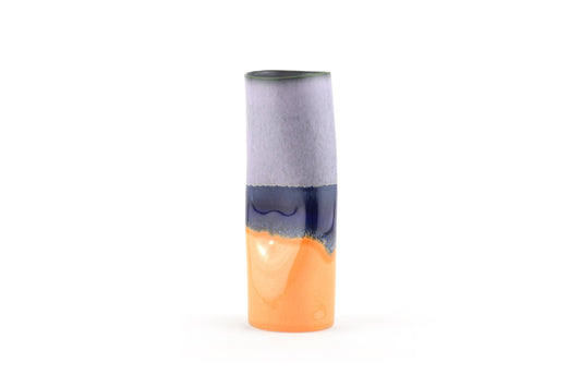 Cylindrical vase with two-tone design on a white background