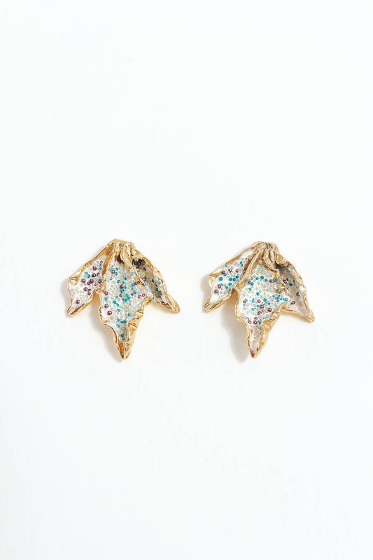 Gold and beaded leaf-shaped earrings on a white background